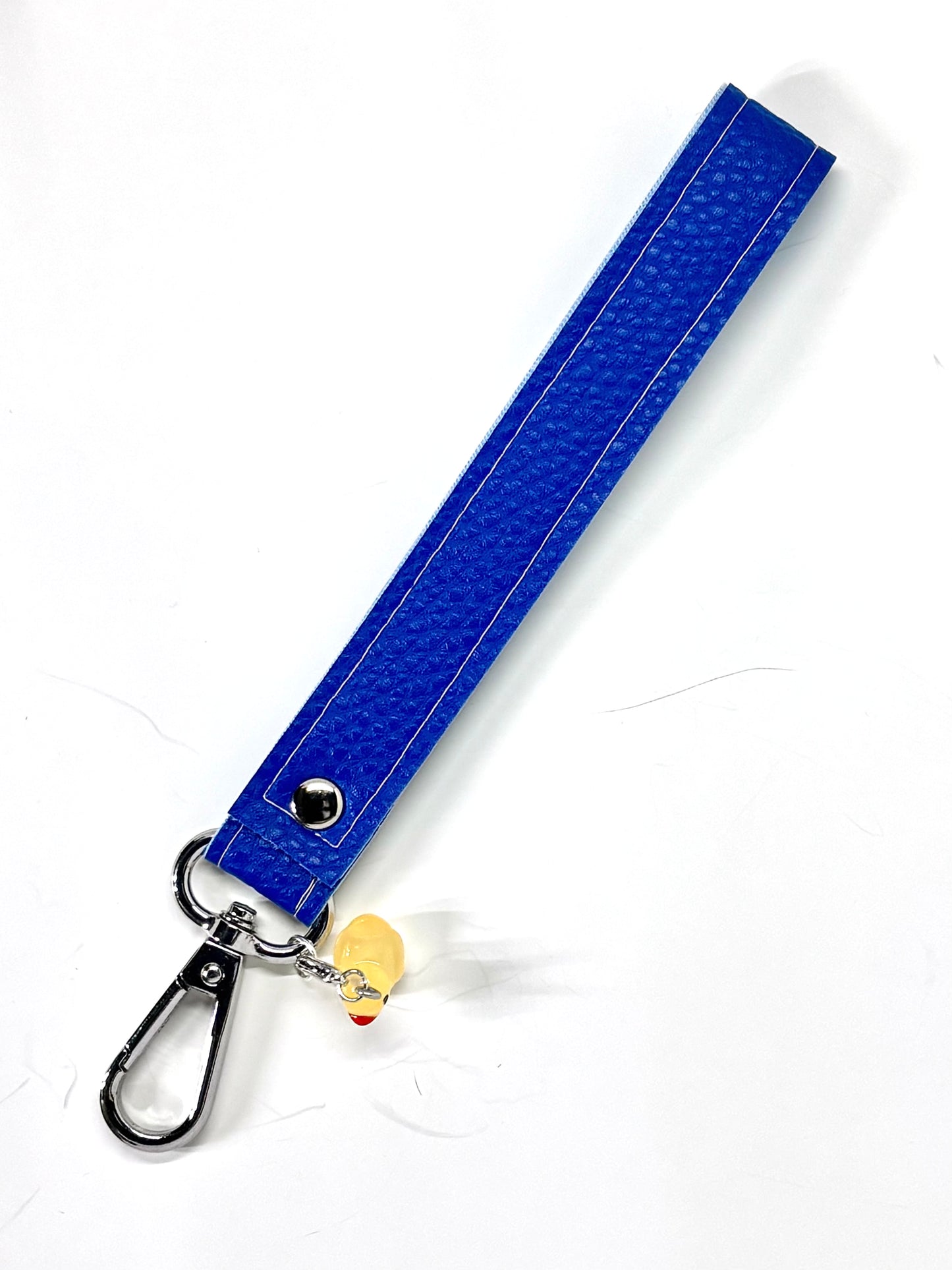 Vegan  leather wristlet with swivel hook and charm